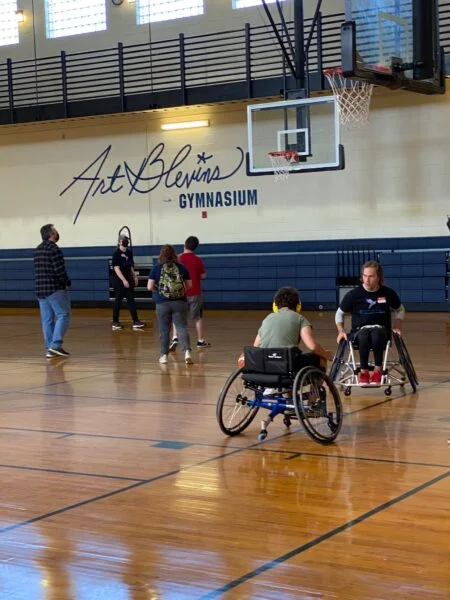 two wheelchair users on basketballcourt